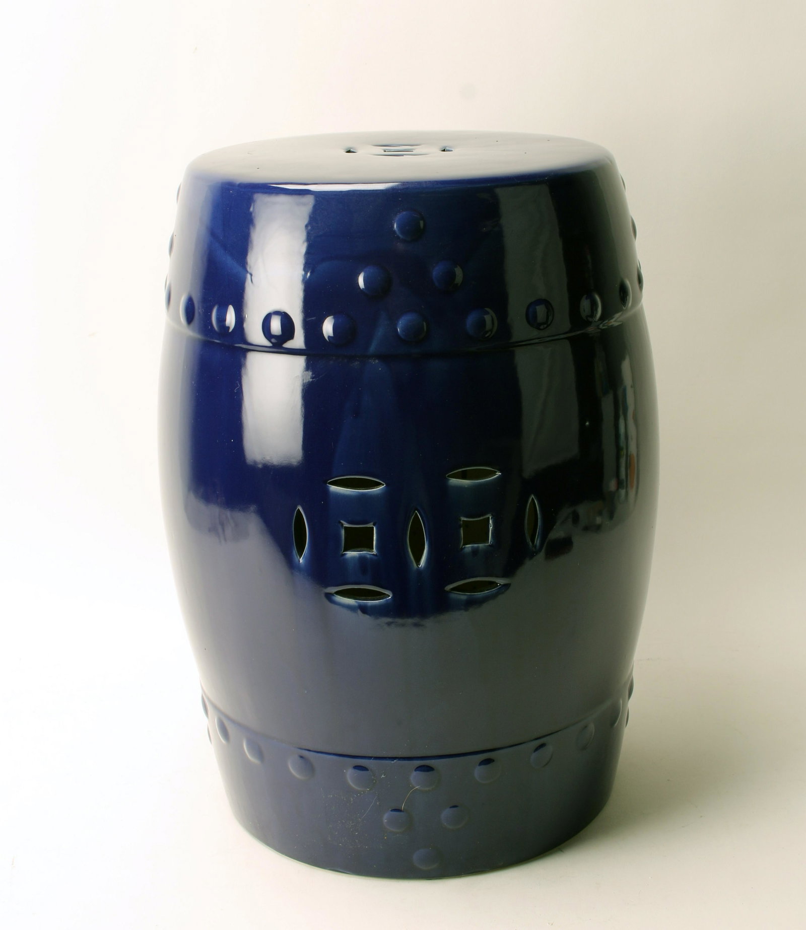 COBALT BLUE GARDEN STOOL: Cobalt Blue Garden StoolIn shiny cobalt blue glaze with pierced lucky coins on top and sides.