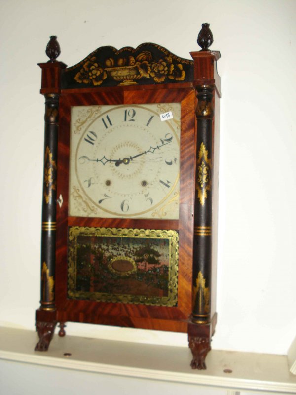 Jerome and Darrow shelf clock : A 30 hour shelf clock with a stencil decorated case and crest with carved pineapple finials and hairy paw feet. American, 1830s.