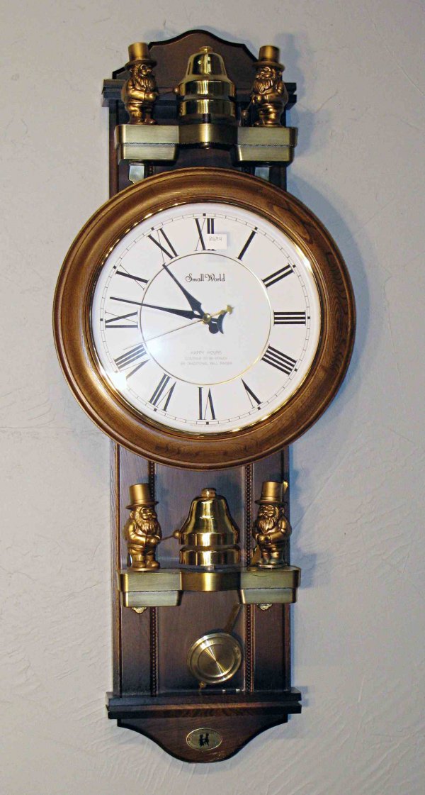 Musical wall clock : A battery operated wall clock that heralds in the hours by playing, electronically, "Its a Small World" and also has functioning automata.