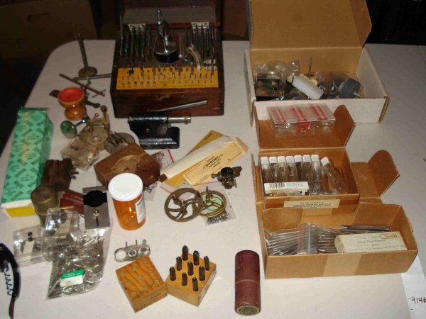 Watchmaker's tools and parts: Includes a larger well-appointed boxed watchmaker's stake set and many replacement punches, etc, movement holders, calipers, and parts.