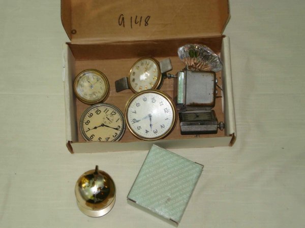 Car clocks and desk clocks : Two smaller clock may be early car clocks, one desk clock in the form of a globe. About 8 items.