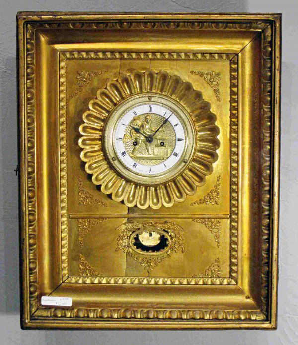 Biedermeier wall clock: A mid 19th century gilt wood and framed two day 19th century Austrian wall clock, 18" in height and 15" long. The porcelain and pressed brass dial has an automation Cupid, who hammers arrows when the