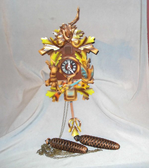 A cuckoo clock : A 20th century German Black Forest cuckoo clock of the eight day running variety.