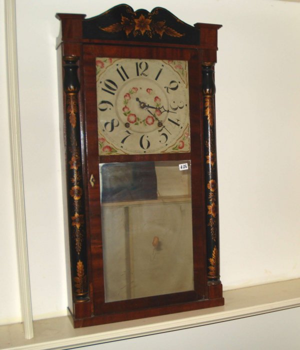 Shelf clock by Jerome & Darrow : A stencil decorated shelf clock with sharp stencil decorations on the half columns and crest, with a looking glass below a square painted wood dial.