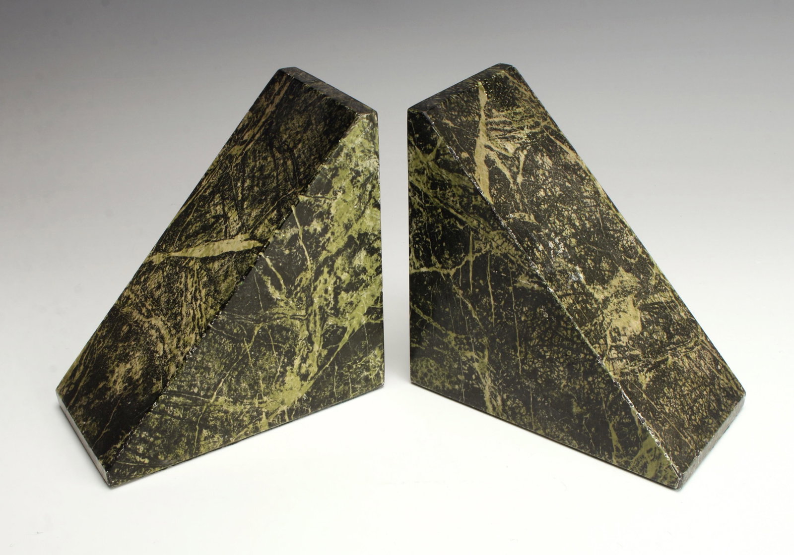 PAIR MARBLEIZED WEDGE BOOKENDS: PAIR MARBLEIZED WEDGE BOOKENDSShades of green from dark to light. Heavy triangular wedges are skillfully marbleized in dark green-b