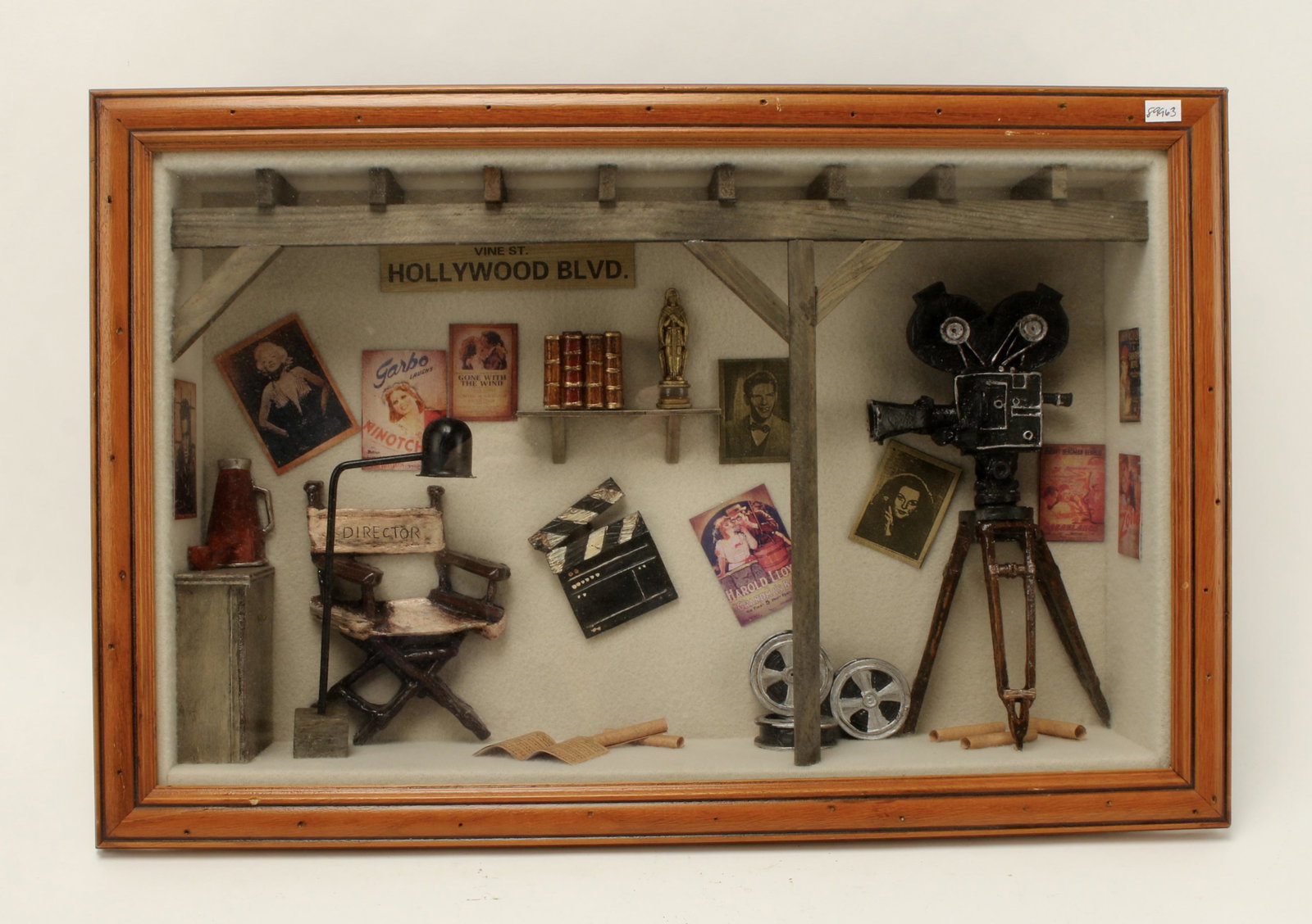 OLD HOLLYWOOD MOVIE DIORAMA: OLD HOLLYWOOD MOVIE DIORAMAShadowbox filled with miniature old Hollywood posters and film items 21" X 14" $20 - $40 <