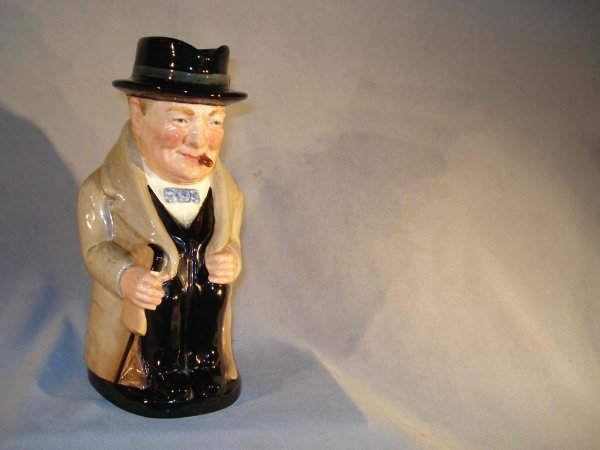 Royal Doulton pitcher of Winston Churchill: A 10" commemorative "Toby" jug by Royal Doulton of Sir Winston with his cigar.
