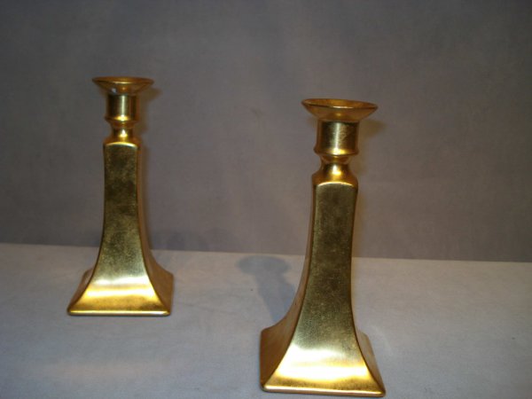 Gold porcelain salts and candle sticks: A set of six porcelain luster gold toned salt & peppers with a pair of Paris style gold porcelain candlesticks, each 8" (repaired break on one), signed "Healey Gold".
