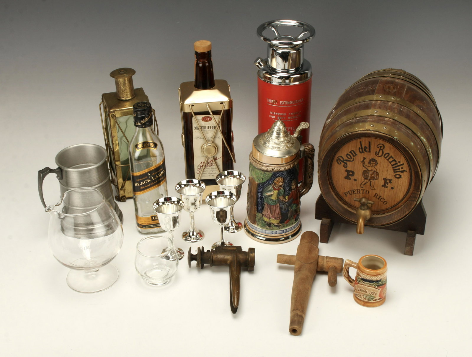 VINTAGE BAR MAN CAVE LOT: VINTAGE BAR MAN CAVE LOT Antique brass bottle corker marked "La Merveilleuse" or "The Wonderful", Ron del Barrilito 1 gal. rum barrel on stand, novelty thirst exting