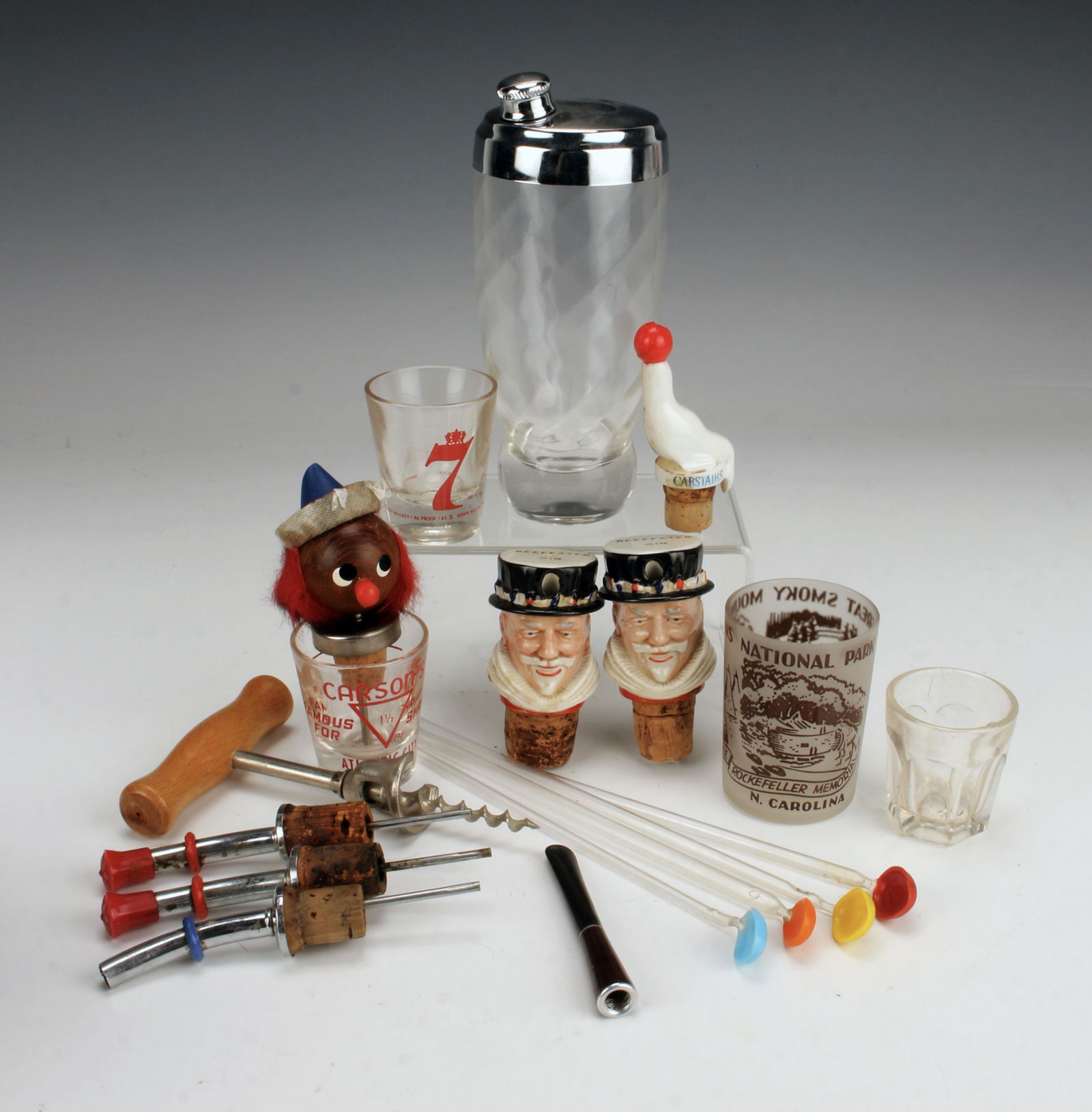 VINTAGE BAR TOOLS LOT: VINTAGE BAR TOOLS LOT Beefeater Gin pourer corks, Wooden funny head pourer, Carstairs seal pourer, 3 stainless pourers, corkscrew, Yello-Bole Health Holder cigarette holder, martini