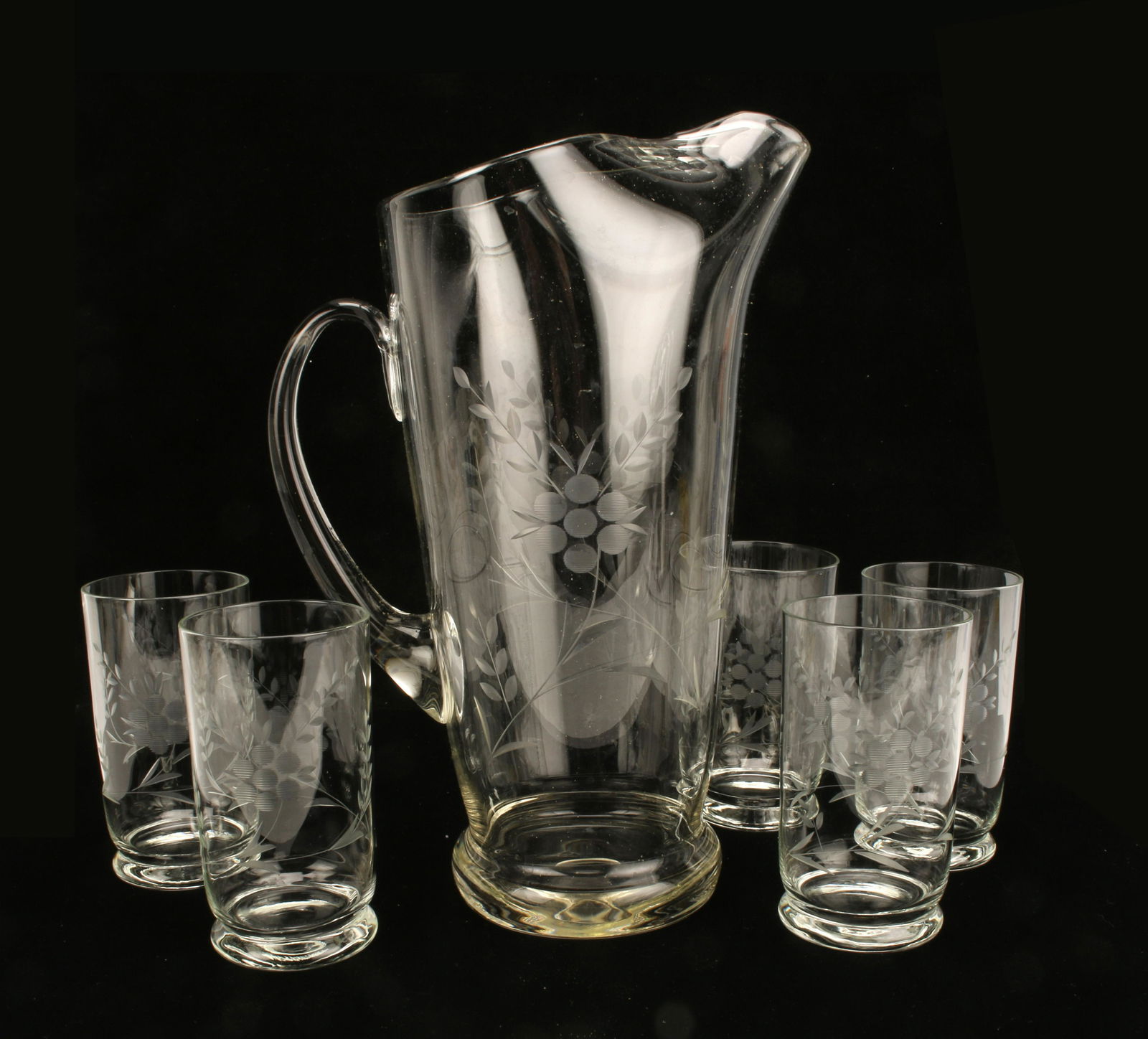 BLOWN GLASS ETCHED PITCHER & GLASSES: BLOWN GLASS ETCHED PITCHER & GLASSES Tall blown glass pitcher with etched floral sprays and 5 matching iced tea/ highball glasses. Perfect for sangria, iced tea, or extra large marti
