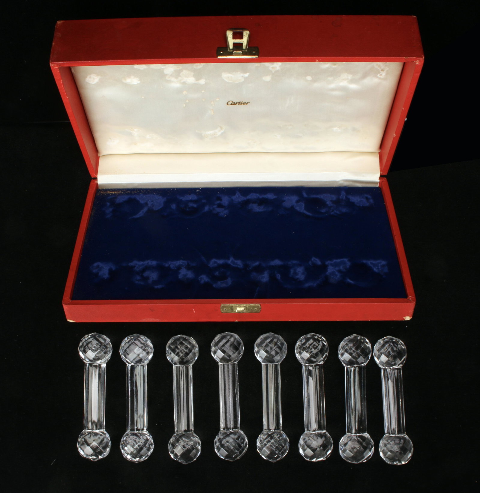 EIGHT CARTIER KNIFE RESTS IN BOX: EIGHT CARTIER KNIFE RESTS IN BOX In red Cartier box. Box has wear. 10 1/2" X 6" $100 - $200 Sh