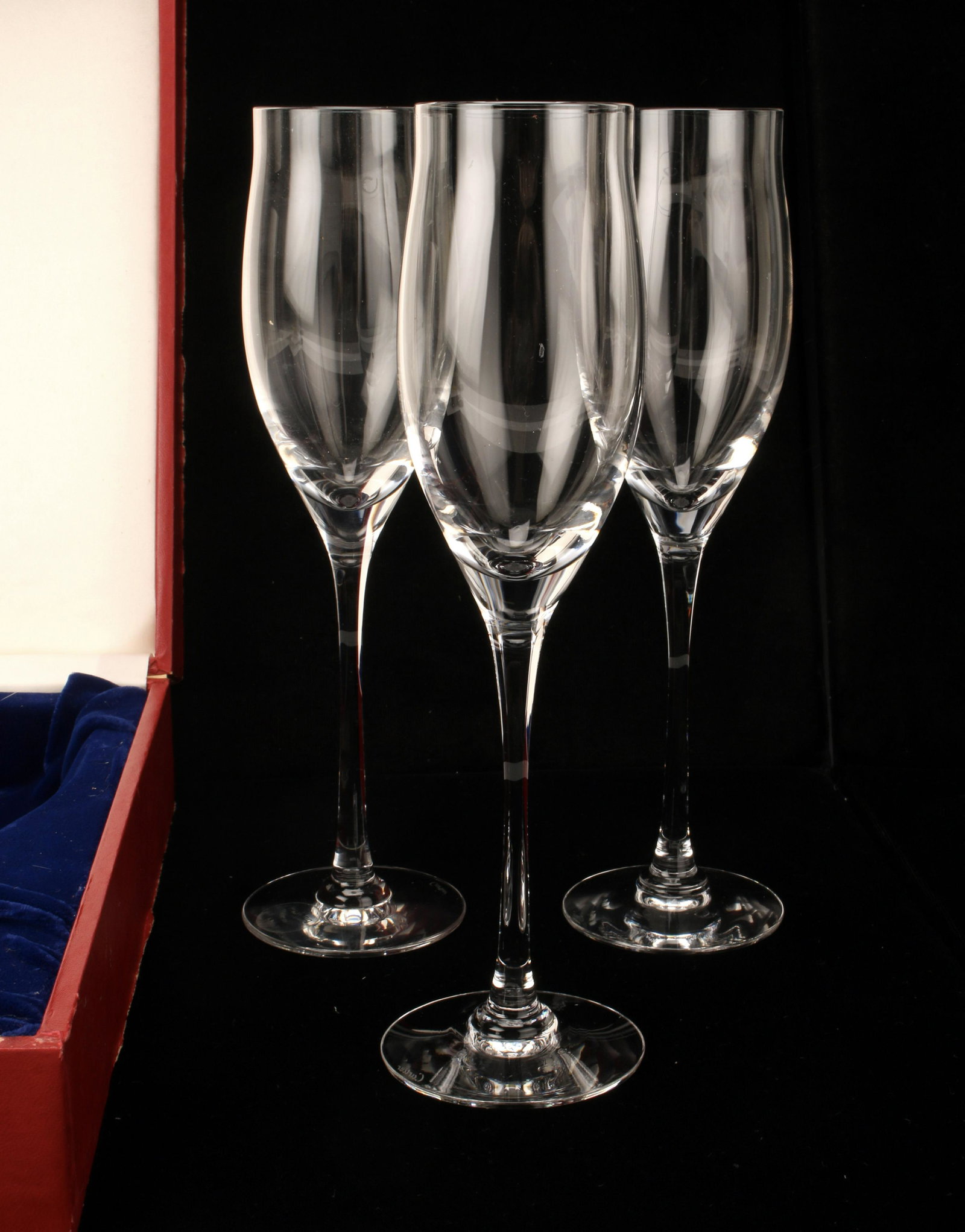 CARTIER CRYSTAL CHAMPAGNE TULIP FLUTES IN BOX: CARTIER CRYSTAL CHAMPAGNE TULIP FLUTES IN BOX 3 Cartier champagne tulip flutes, in padded red Cartier box *box has wear 10 3/4" X 14 1/2"