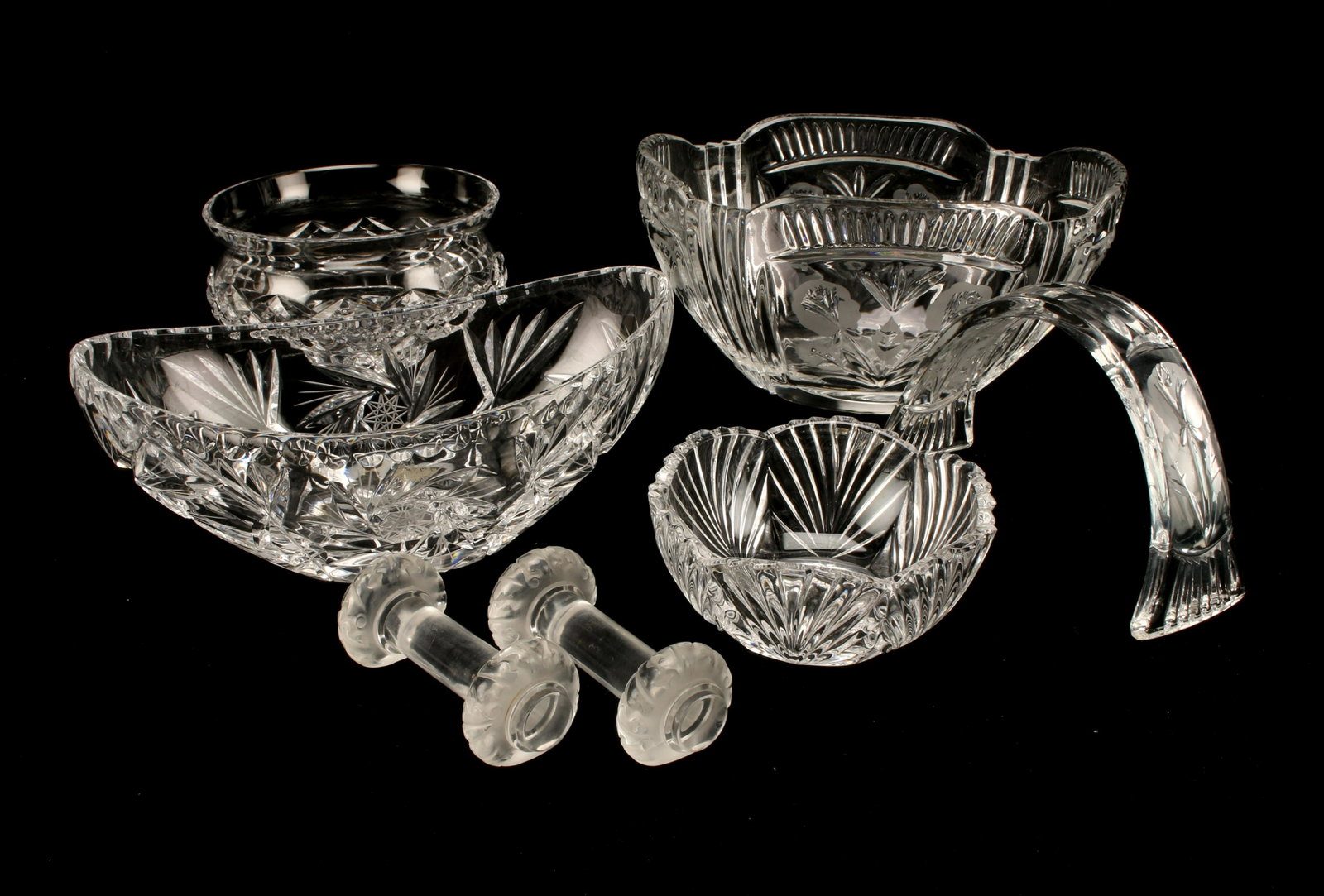 CUT CRYSTAL BOWLS, KNIFE RESTS WATERFORD LALIQUE: CUT CRYSTAL BOWLS, KNIFE RESTS WATERFORD LALIQUE Three cut crystal bowls, one marked Waterford. Two knife rests marked Lalique. One arched piece of glass, possibly handle to bowl.
