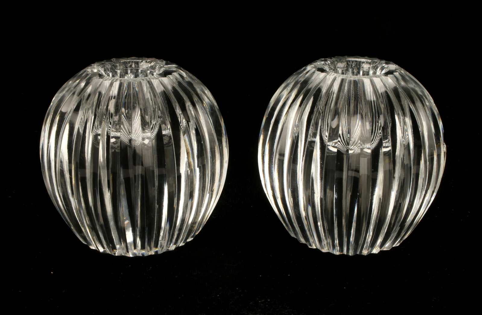 PAIR CARTIER RIDGED CUT CRYSTAL BALL CANDLEHOLDERS: PAIR CARTIER RIDGED CUT CRYSTAL BALL CANDLEHOLDERS Marked on bottom. *both have edge chips 3 1/2" $100 - $200