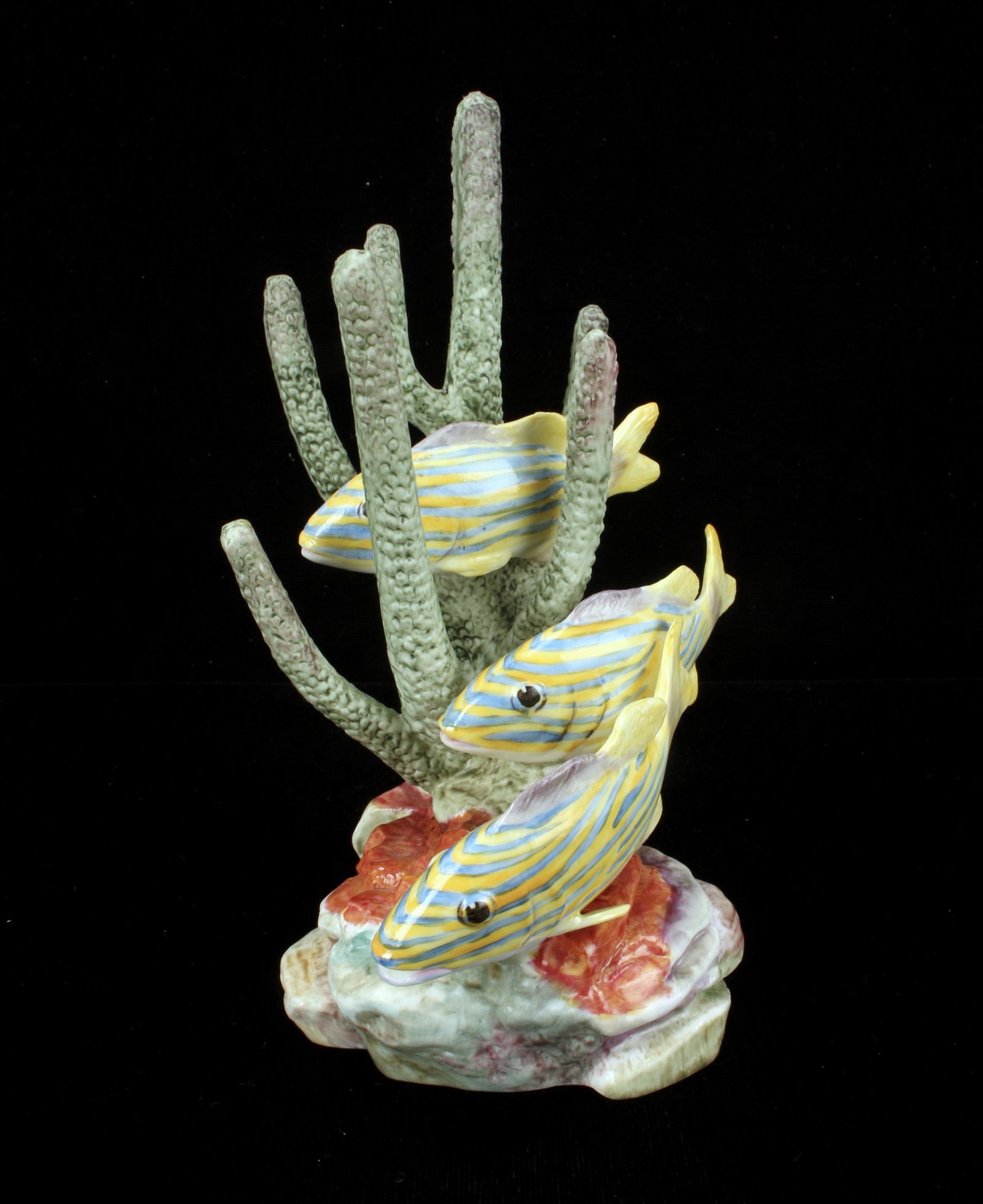 ROYAL WORCESTER PORCELAIN YELLOW GRUNT FIGURINE: ROYAL WORCESTER PORCELAIN YELLOW GRUNT FIGURINE Three yellow fish with blue stripes swimming among the coral. Series 3576 by R. VanRuyckelt. 5 3/4" X