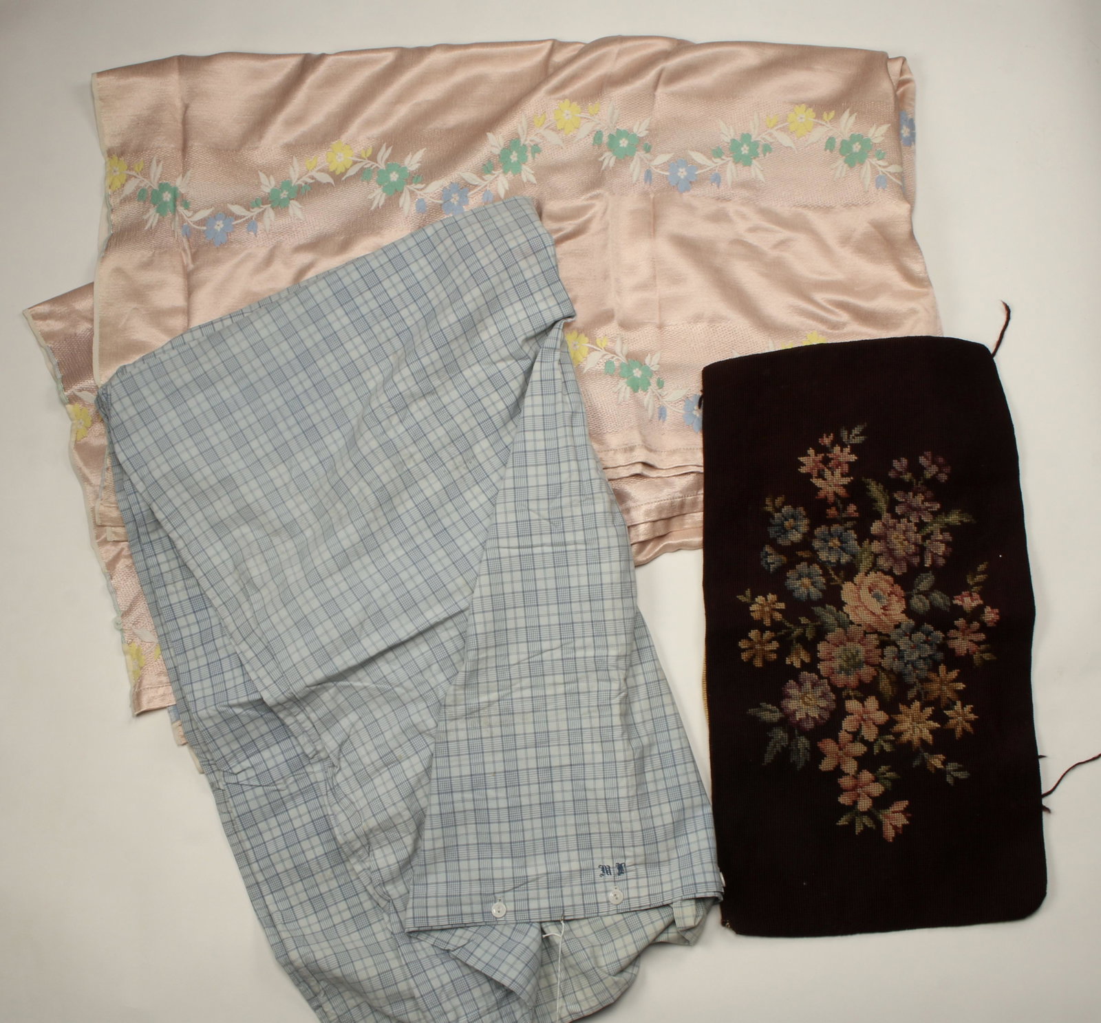 BED LINENS & CHAIR COVER: BED LINENS & CHAIR COVER Pink floral embroidered bedspread 80" X 90". Blue plaid twin duvet cover 45" X 72". Needlepoint bench cover 26" X 14 1/2"