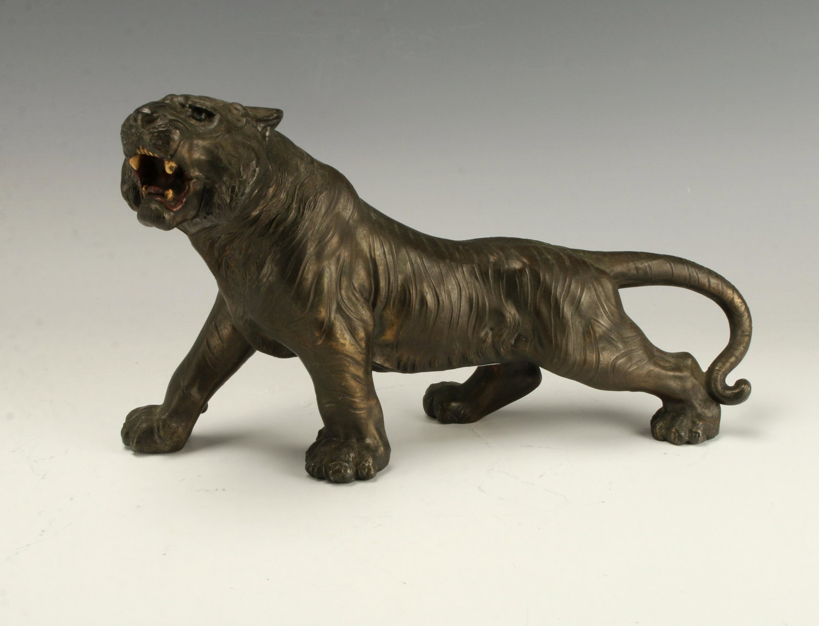 STATUE OF ROARING TIGER: STATUE OF ROARING TIGER A tiger is protecting its territory with open mouth and strong stance. 13 1/2" X 7 1/2" $40