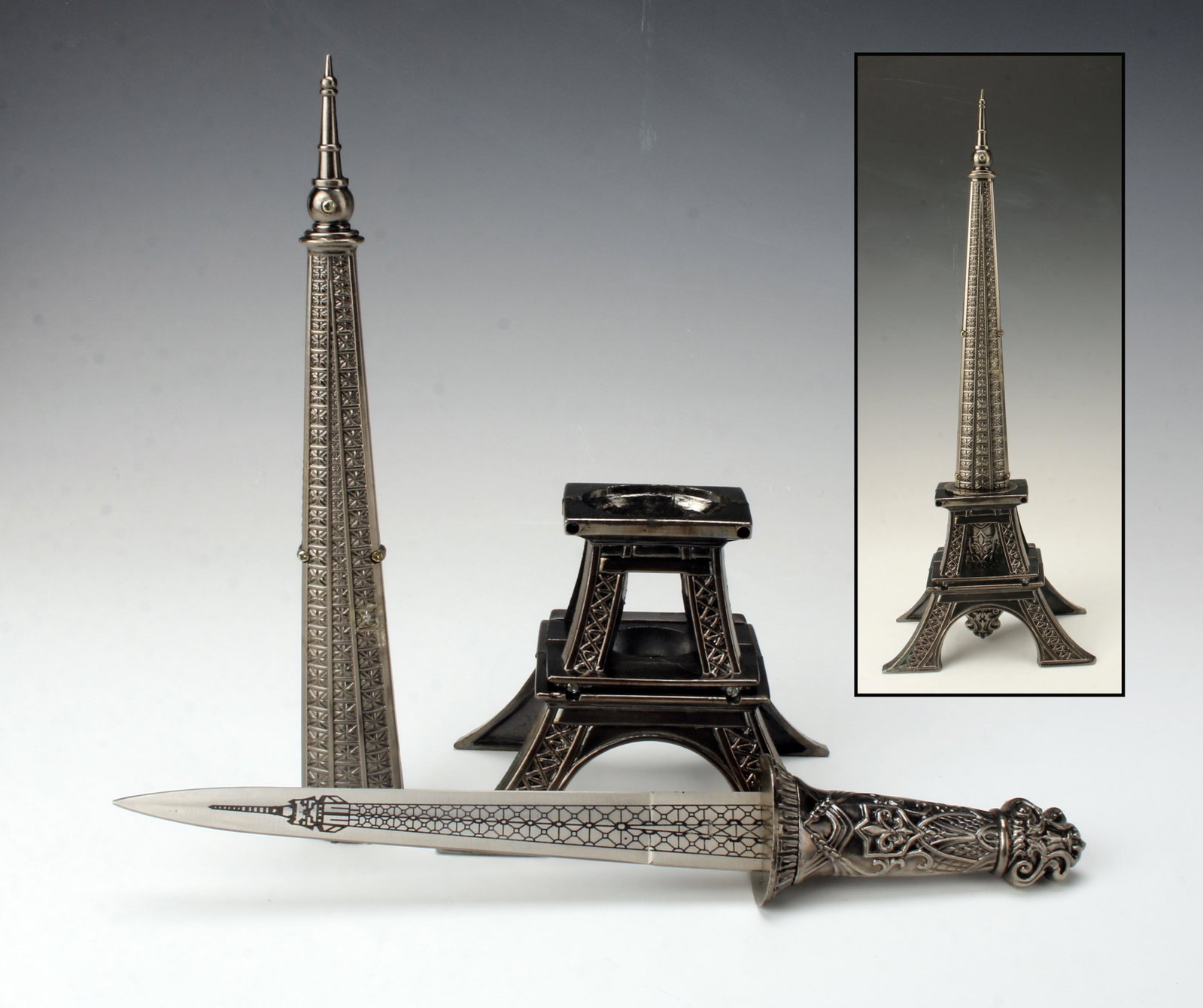 EIFFEL TOWER DAGGER LETTER OPENER: EIFFEL TOWER DAGGER LETTER OPENER Stainless steel blade and plastic base, marked China *blade slightly loose 5 1/4" X 15 1/4" <