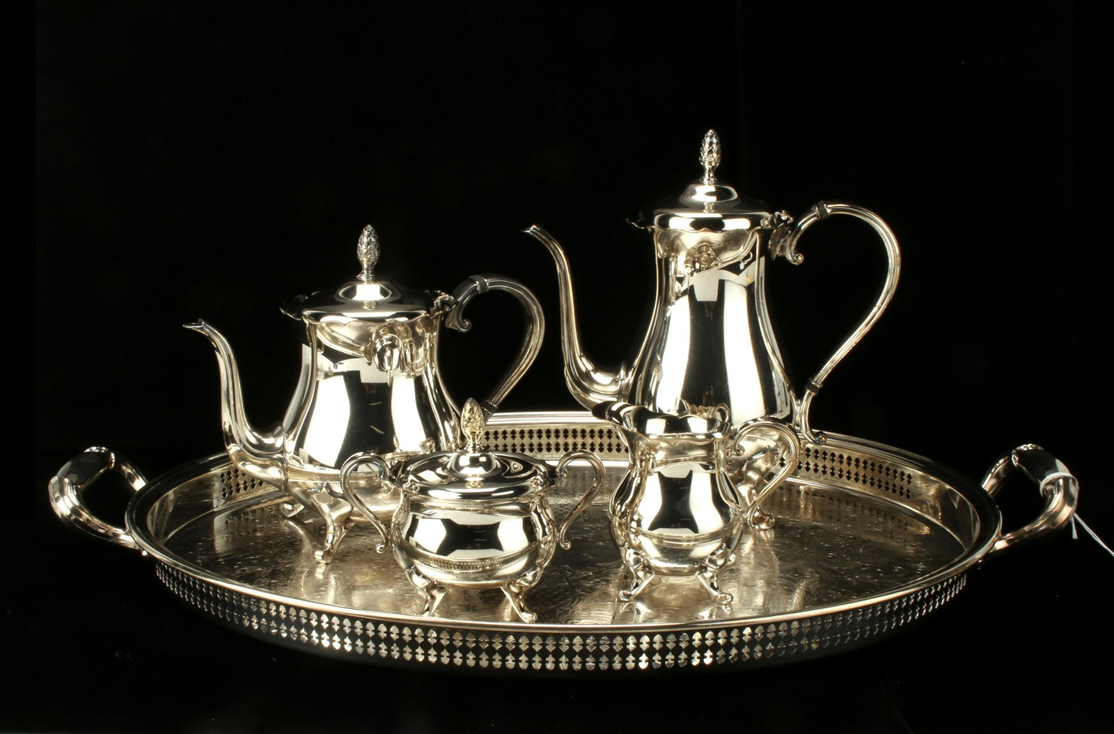NEWPORT SILVER PLATE COFFEE TEA SET: NEWPORT SILVER PLATE COFFEE TEA SET Coffee pot, teapot, sugar and creamer on matching tray. Coffee pot, teapot, and sugar have pineapple finials. 25"
