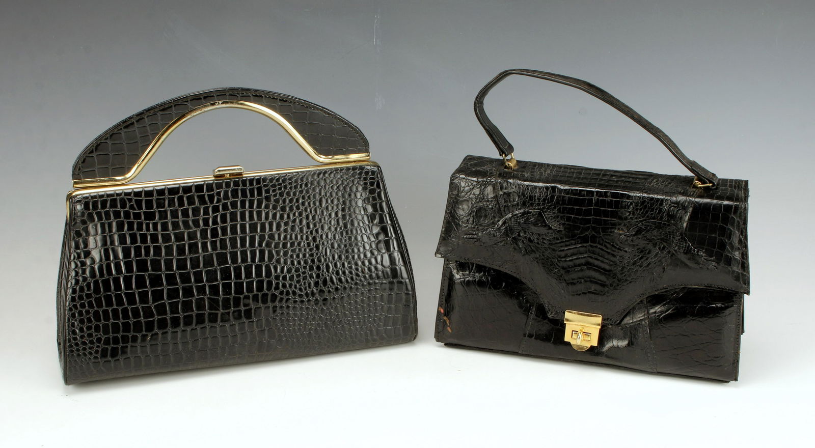 BLACK ALLIGATOR PURSE & BLACK HANDBAG CLUTCH: BLACK ALLIGATOR PURSE & BLACK HANDBAG CLUTCH Alligator purse with toggle latch, marked Genuine alligator Made in Florida. Black handbag with alligator finish and gold accents and cla