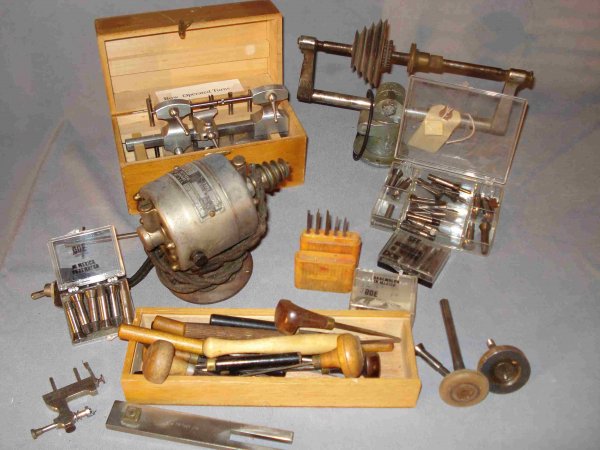 Assorted Tools: An assortment of clock maker's tools, mostly lathe related, including assorted gravers, three sets of collets, a boxed set of "bow operated turns", and other miscellaneous tool accessories.