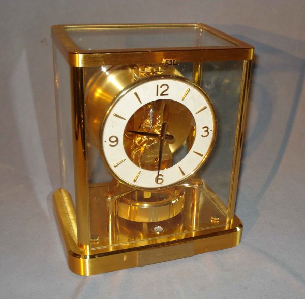 Atmos Clock: An Atmos clock signed ATMOS and Jaeger-LeCoultre with the serial number 616233 along with a presentation plaque indicating a date of 1986.