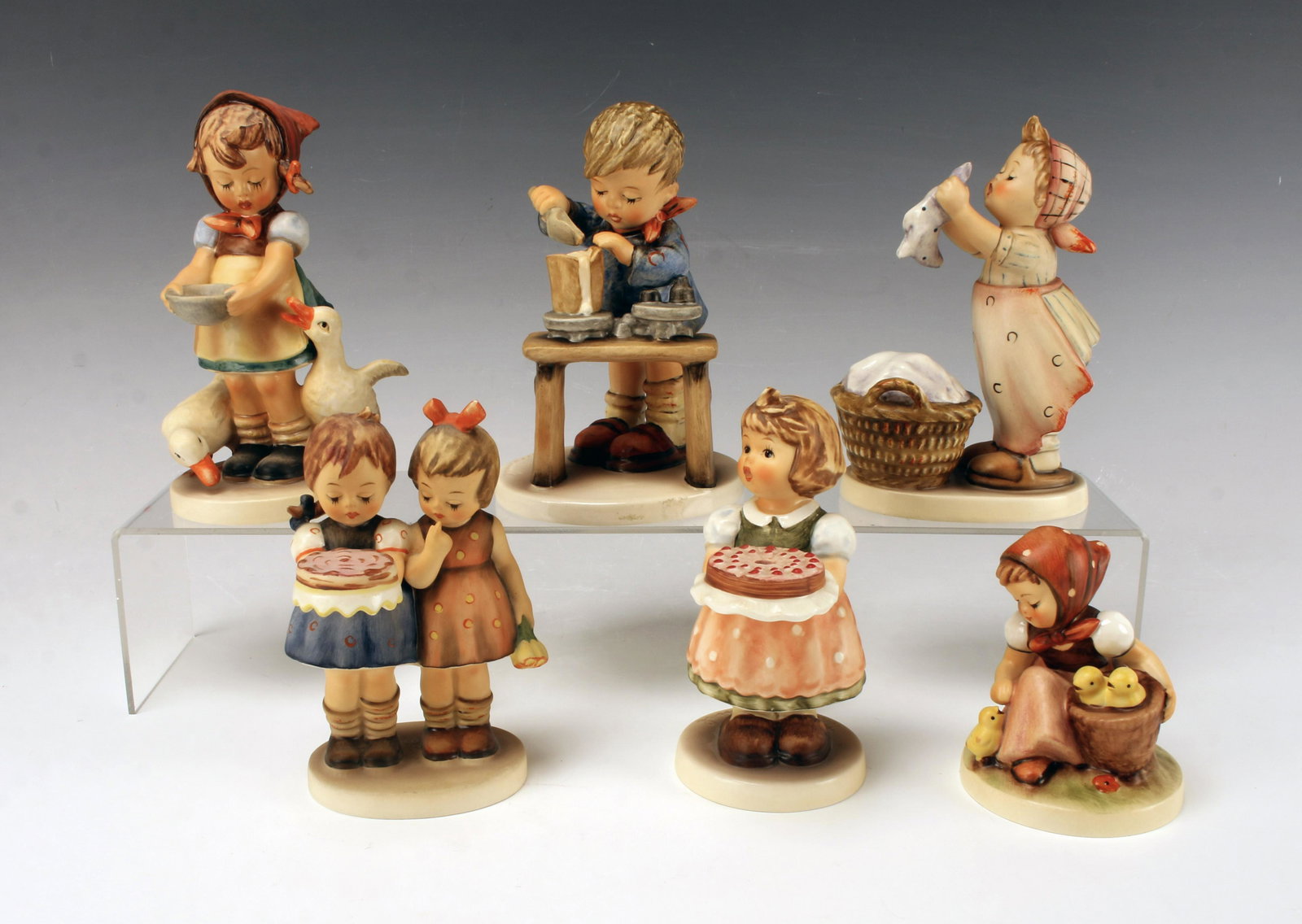 SIX HUMMEL FIGURINES (1 of 6)