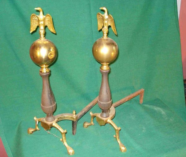 Andirons: A pair of brass and cast metal andirons with spread eagle finials.