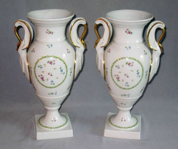 Porcelain by Limoges: A pair of fine porcelain vases marked Limoges and "Bernardaud", with luster gold accenting sparse floral decorations against an off-white underglaze, in the "old" manner of porcelain. Each about 15" i