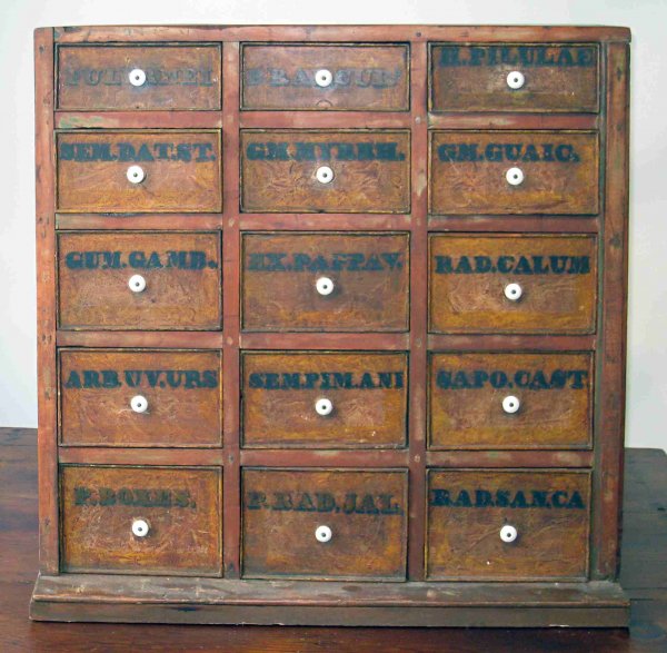 Apothecary Chest: An apothecary stand with 15 individual drawers in original paint. Origin upstate New York.