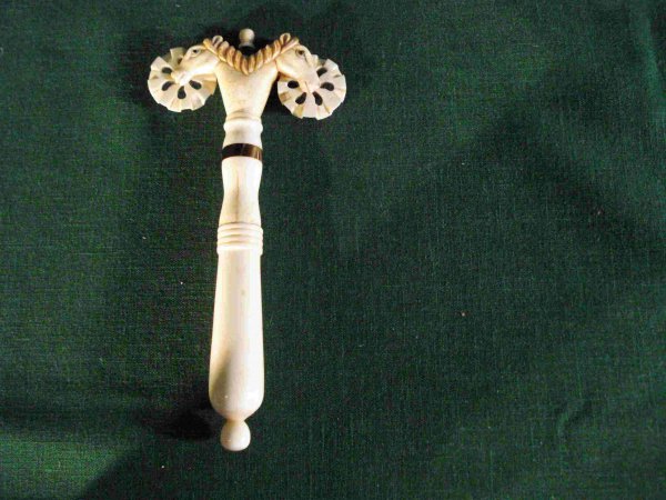Carved Whale Bone Pie Crimper: A fine whale bone double sided pie crimper carved with horse heads and a bone handle. The handle has repaired splits due to shrinkage.