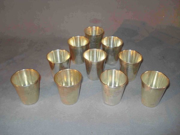 Sterling Shot Glasses: A set of ten sterling shot glasses each engraved "R H C/Trap Shooting /Weekly Prize/ 1925-1926" and marked "International Sterling". 13.5 ozt.