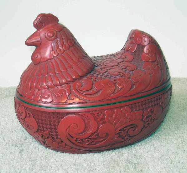 Cinnabar Rooster: A Cinnabar rooster opening to a container. Measures 12" long.