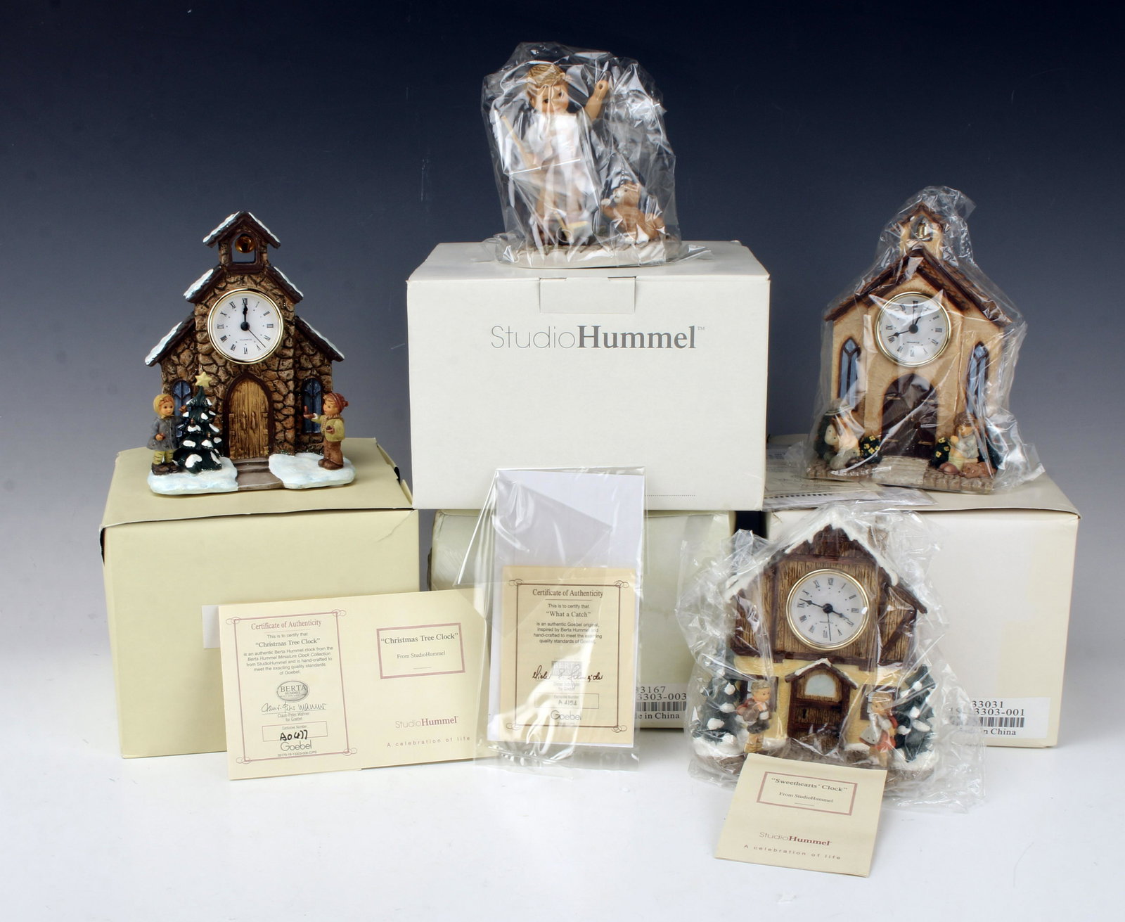 FOUR HUMMELS IN BOXES (1 of 5)