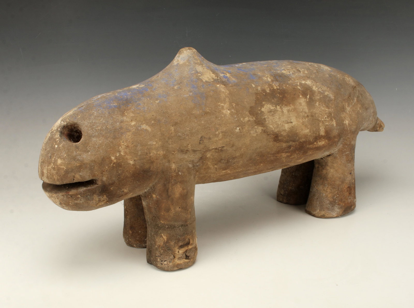 MBOLI MALI ANIMAL FORM: MBOLI MALI ANIMAL FORM Vestiges of blue pigment. Large nostrils and an open mouth. Four trunk shaped legs, short straight tail and a hump like a camel. 25