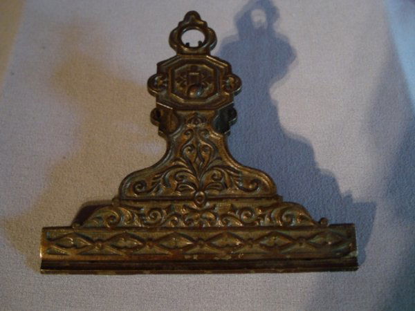 Cast iron bill clip: A cast iron spring loaded Victorian bill clip, dated on the back:"pat Jan 23 1874".