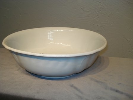 14 1/2" Ironstone bowl: A 14 1/2" white Ironstone bowl marked marked "Ironstone China, J & G Meakin...". One chip on the base (as seen in detail photo), but otherwise lacking any imperfections.