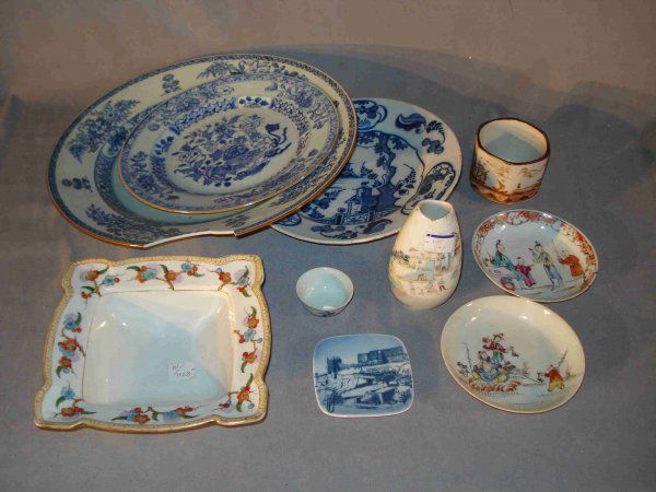 Assorted chinese ceramics: Including a larger delft charger (damaged), and other chargers (repairs) a brown glazed tea cup (reproduction) a porcelain bud vase, a pair of dishes (which are in good condition), etc.