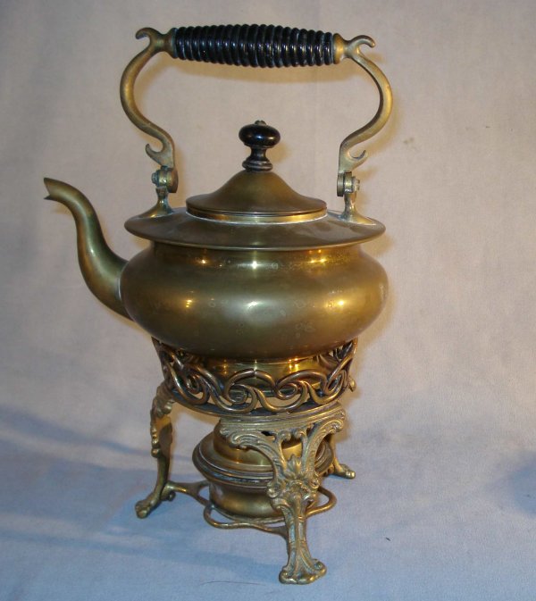 Brass kettle and warmer: A brass and ebonized wood kettle with a warmer stand, 11" in height.