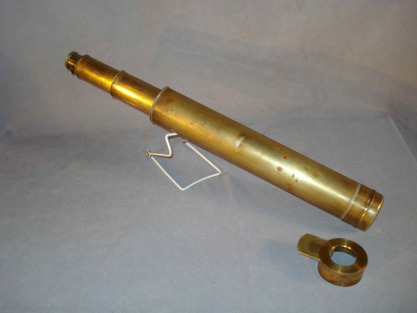 Brass spyglass: A 19th century brass spyglass that telescopes out to 38". The lenses look good, but the screw-on components are loose and we think the larger cylinder once had a leather covering, now gone.