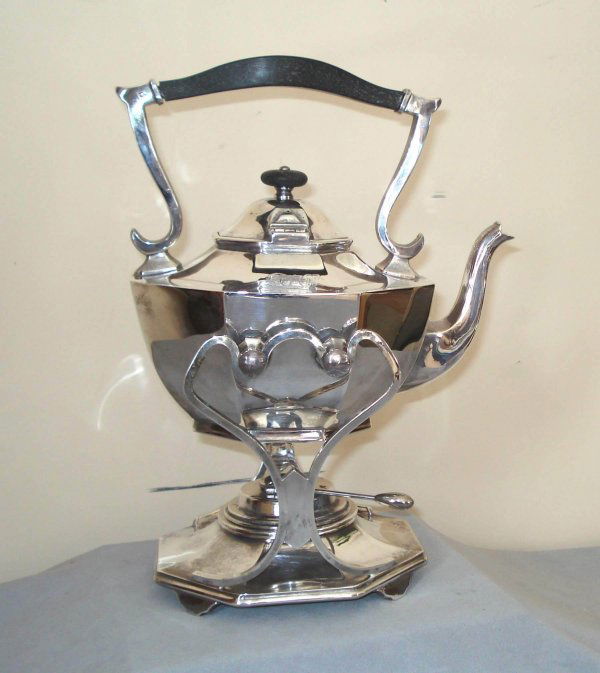 Teapot and warmer: Ebony and silver plate 19th teapot, complete with cradle and warmer.