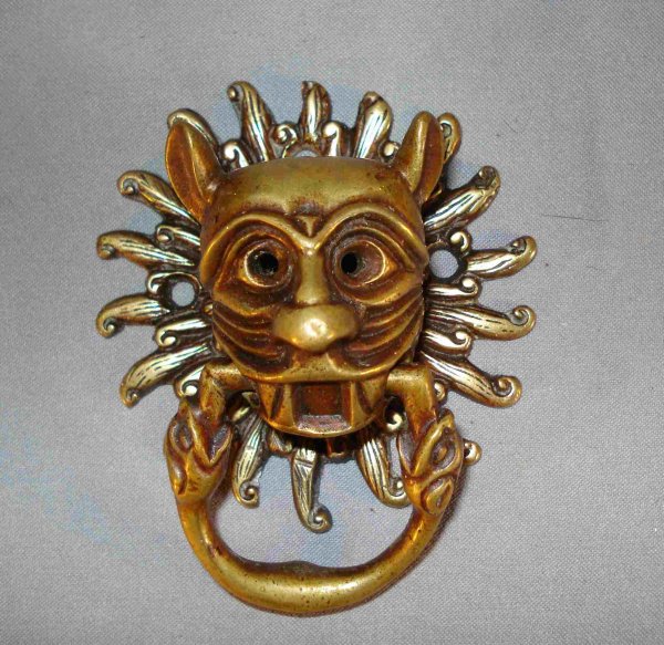 Brass door knocker- Sun Leopard: An antique solid brass door knocker, about 4 1/4", that may be good mounted on interior door. This shows a leopard like creature against a sunburst.