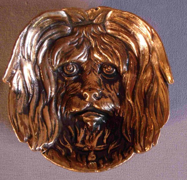 Dog: A solid brass pin holder with the face of a shaggy dog, about 5".