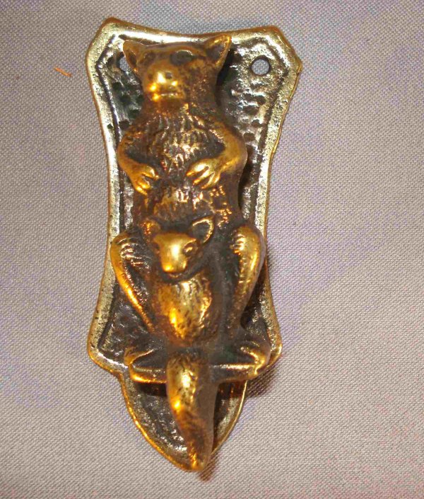 Kangaroo knocker: A small (about 3") interior door knocker with a kangaroo. These antique solid brass door knockers are often mounted on interior door.