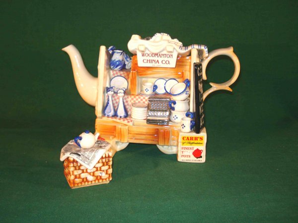 Unusual tea pot by Cardew: A whimsical white ceramic tea pot by the "Woodmanton China Co." signed by the designer P. Cardew. The two piece set includes a sugar with a lid as well as the lidded tea pot, in the form of a china sh