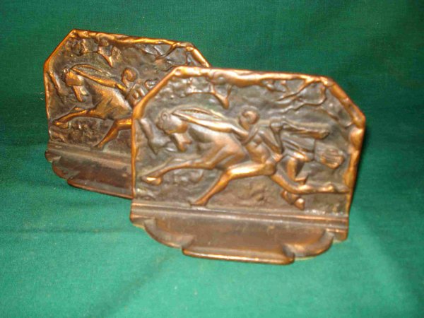 Bronzed Art Deco Book Ends: A pair of Art Deco bookends stamped on the reverse "Horse Tamer" with an antique bronze finish.