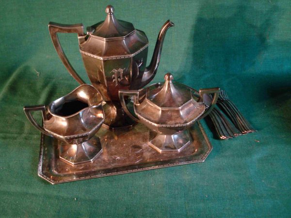 Silver Tea Set: This just in! A four piece silver plate tea set with a teapot, sugar and creamer and matching tray.Also spoons and pickle forks in silver plate, as shown.