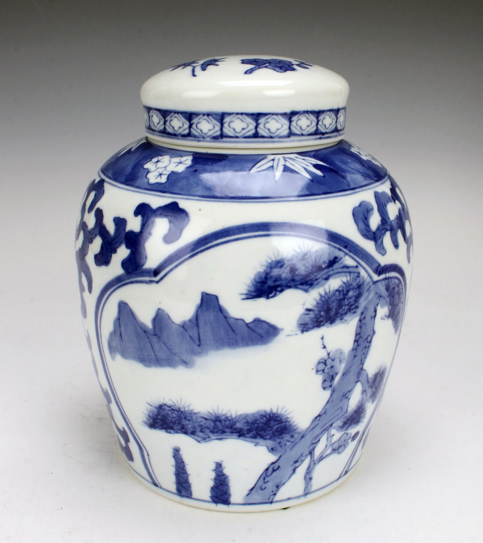 BLUE & WHITE GINGER JAR: BLUE & WHITE GINGER JAR In blue and white glaze. About 8" in height. Bottom reads "Made in China". 6 1/2" X 8"