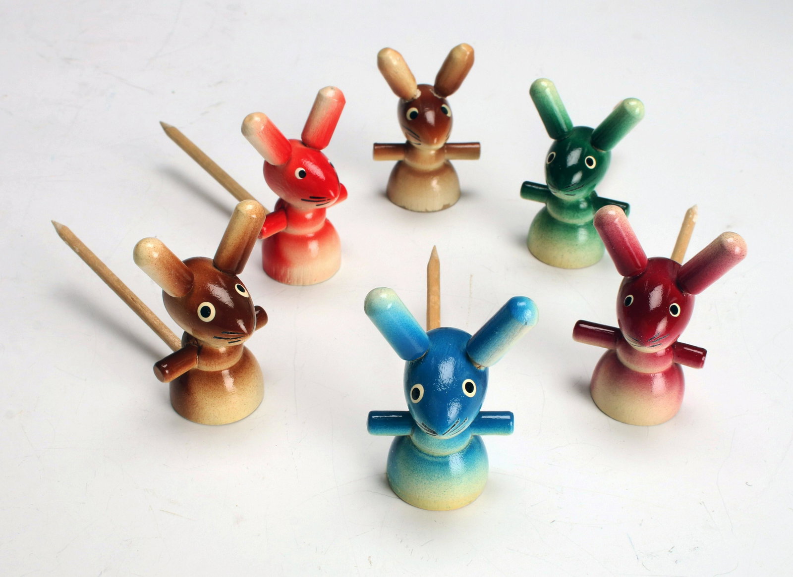 VINTAGE SWEDISH BUNNY RABBIT COCKTAIL PICKS: VINTAGE SWEDISH BUNNY RABBIT COCKTAIL PICKS Five painted wooden bunnies on cocktail skewers picks. One missing pick. Bunny: 1 3/4" tall <
